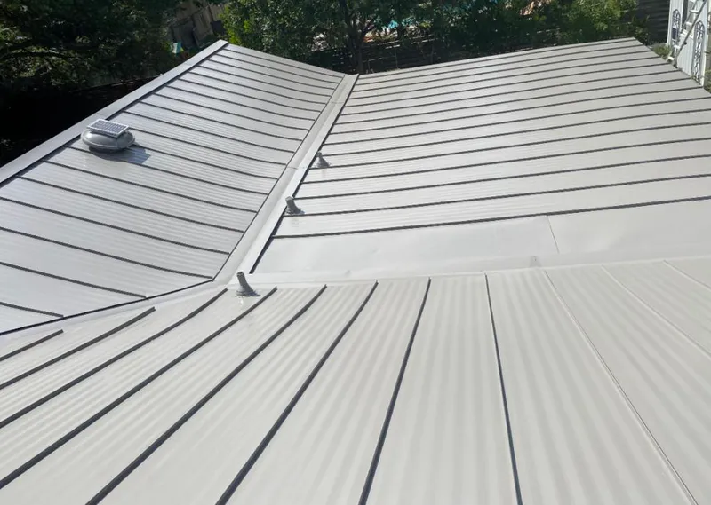 Solar attic fan installed on a metal roof for Roof Ventilation in Florin